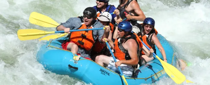 a group of five people enjoying Missoula Rafting