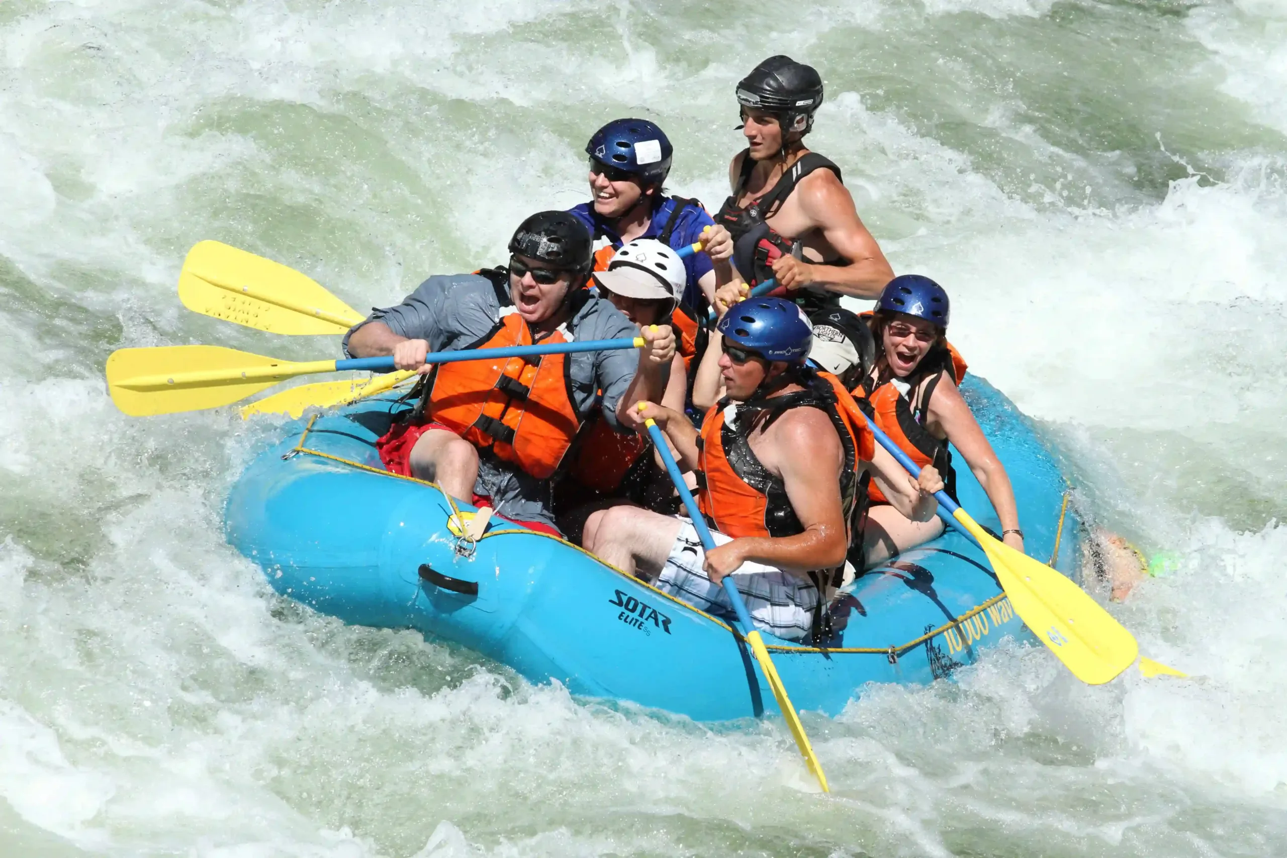 a group of five people enjoying Missoula Rafting